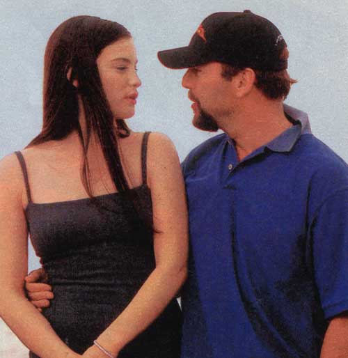 with Bruce Willis, at Cannes 1998