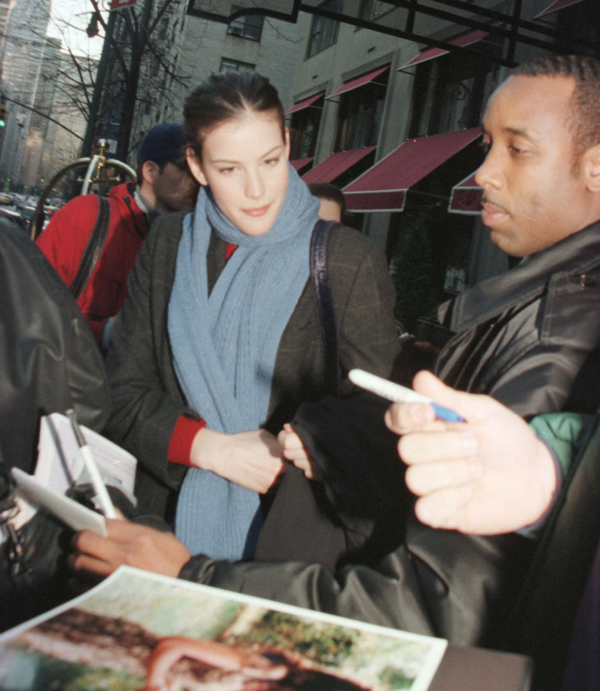 Signing autographs outside Regency Hotel in New York