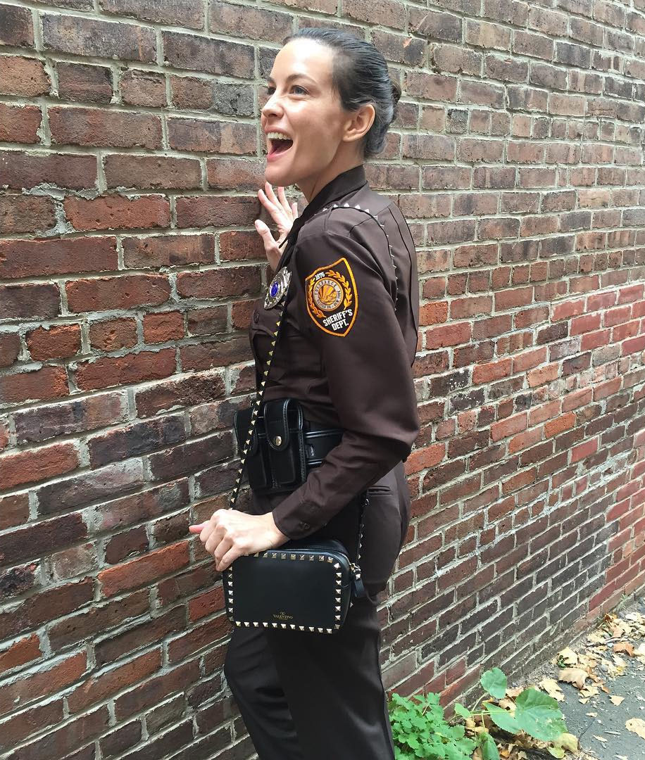 On the set - "When you're playing a cop in a movie but in between takes you just can't quit your @maisonvalentino bag so sweetly gifted by @mytheresa.com"